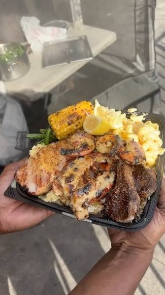 Chicken, shrimp and lamb chop plate with grilled corn, mac n cheese and green beans