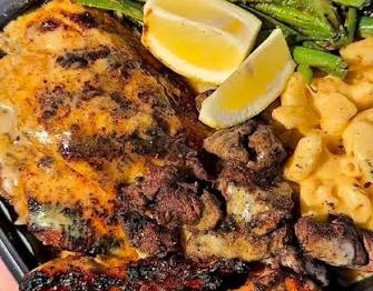 Catfish, chicken and steak plate with green beans and mac n cheese